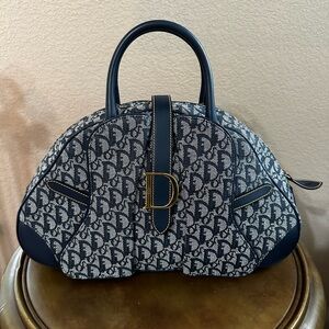 Christian Dior monogram saddle bowling bag.
